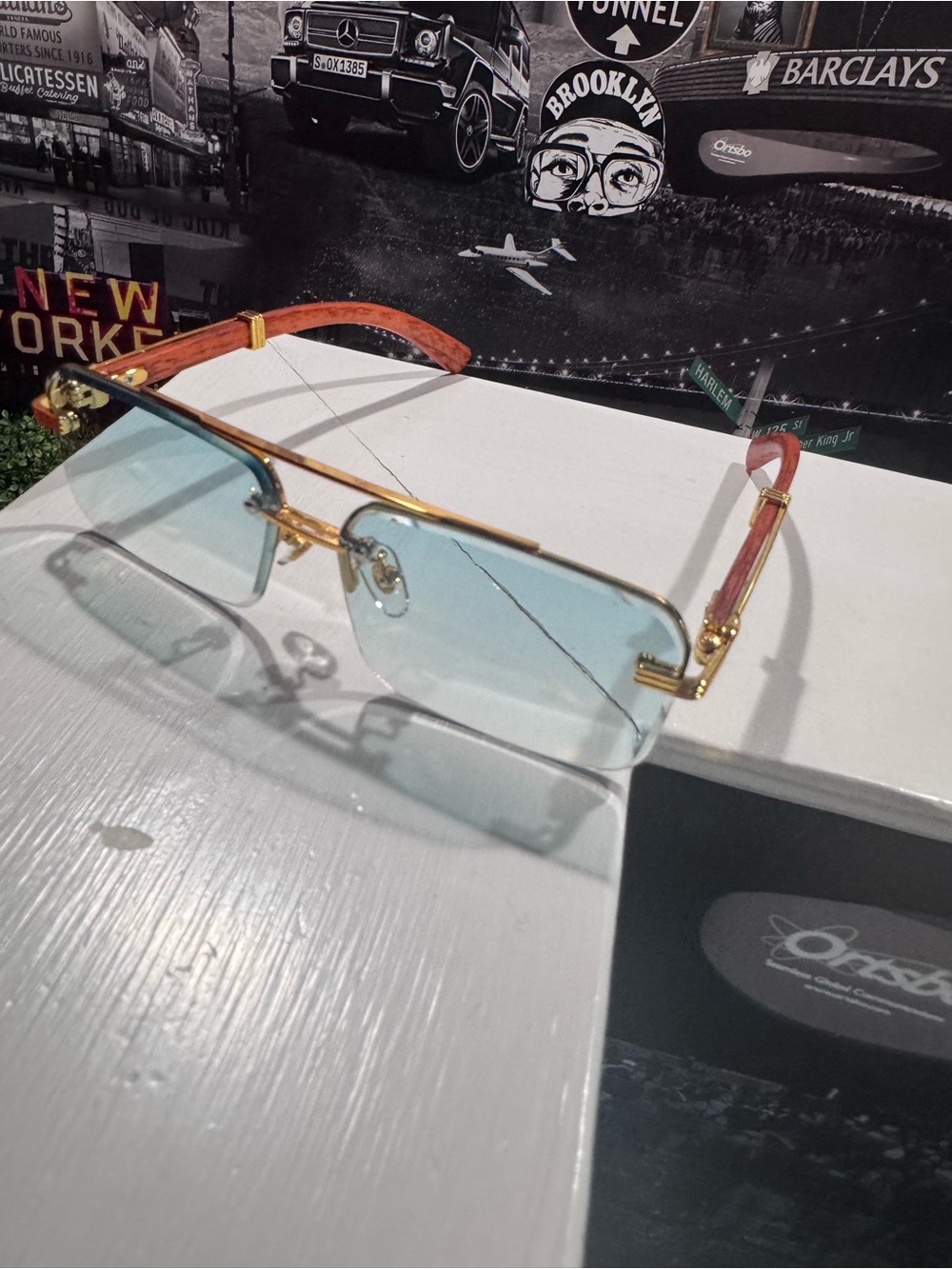 Gold Frame Blue Lens Rimless Sunglasses with Red Temple Accents